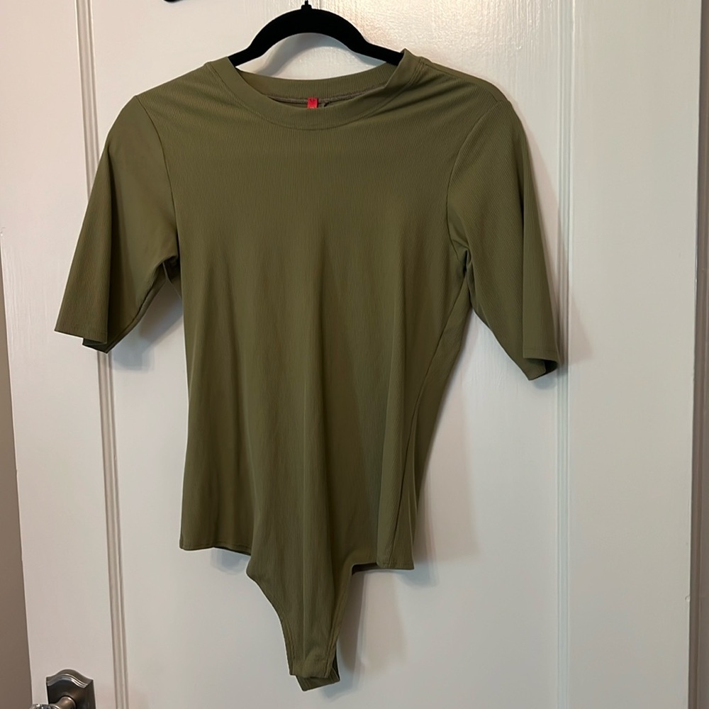 Sage green Spanx bodysuit.